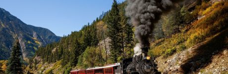 2F8MXEY Durango & Silverton Narrow Gauge Railroad coming around a bend with smoke and steam, San Juan Mountains, La Plata County, Colorado